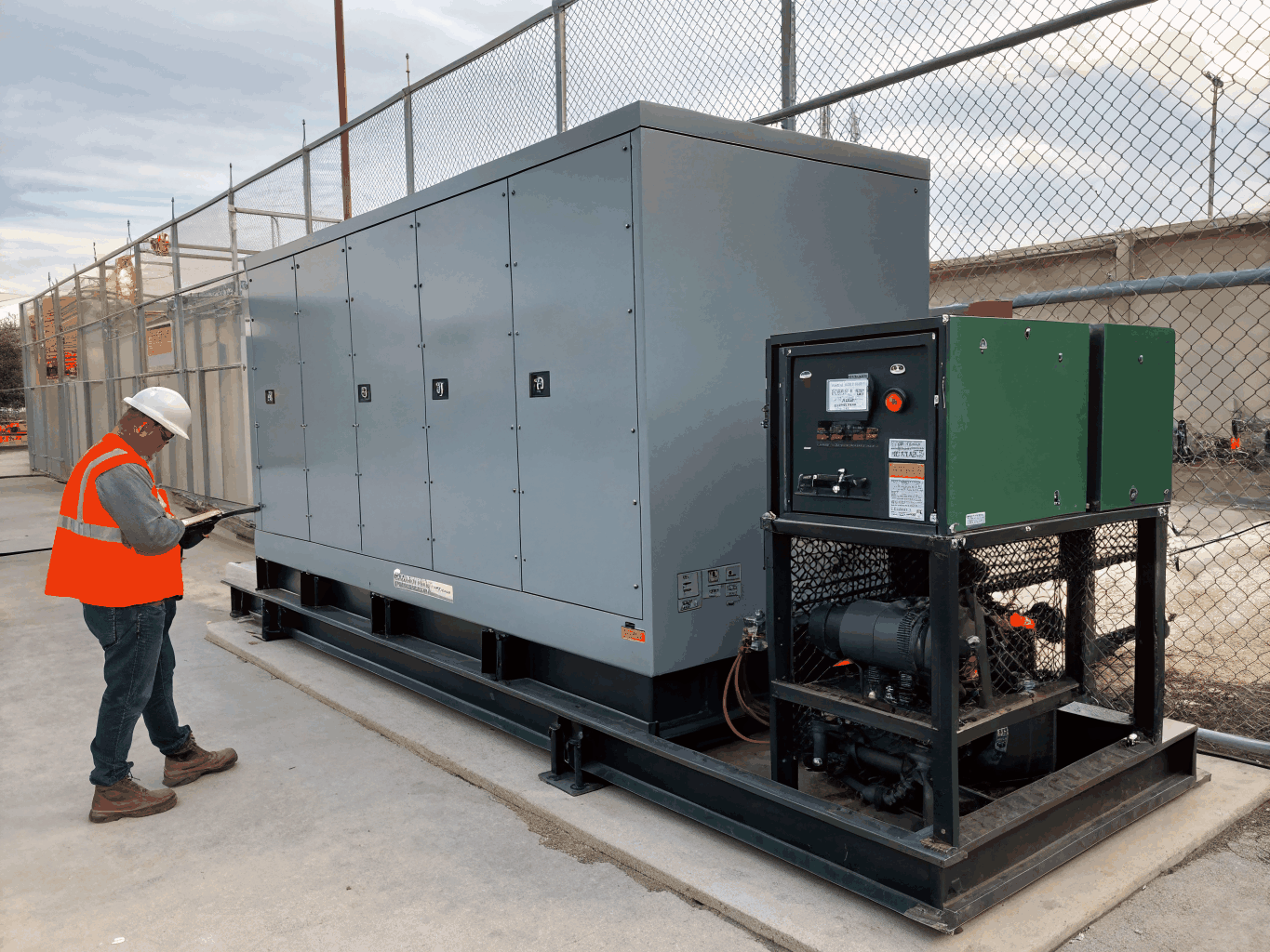 Heavy Caterpillar industrial generator removal in Slough facility